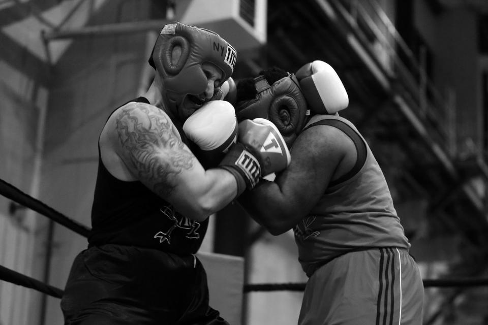 <p>Remington Laboy, left, mixes it up with Gilberto Morales at the “Bronx Tough Turkey Tussle” in the Hunts Point section of the Bronx, New York, on Nov. 16, 2017. (Photo: Gordon Donovan/Yahoo News) </p>