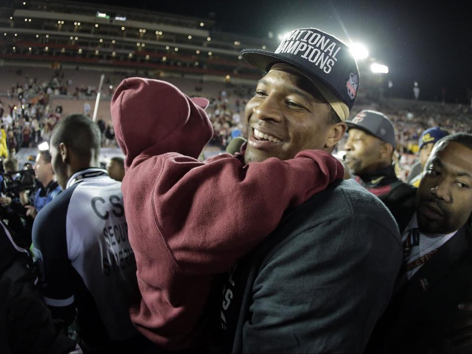 Florida State's Jameis Winston with his brother Jonah after the NCAA BCS National Championship college football game against Auburn Monday, Jan. 6, 2014, in Pasadena, Calif. Florida State won 34-31. (AP Photo/Chris Carlson)