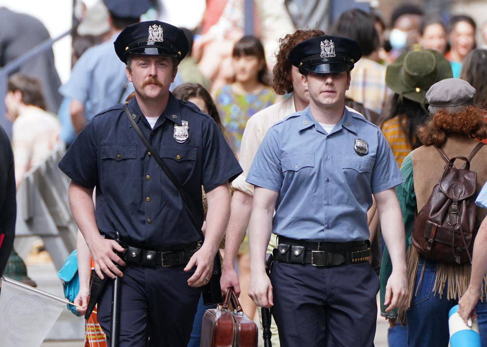 <p>Cast members on Cochrane Street in Glasgow city centre during filming for what is thought to be the new Indiana Jones 5 movie starring Harrison Ford. Picture date: Wednesday July 14, 2021.</p>
