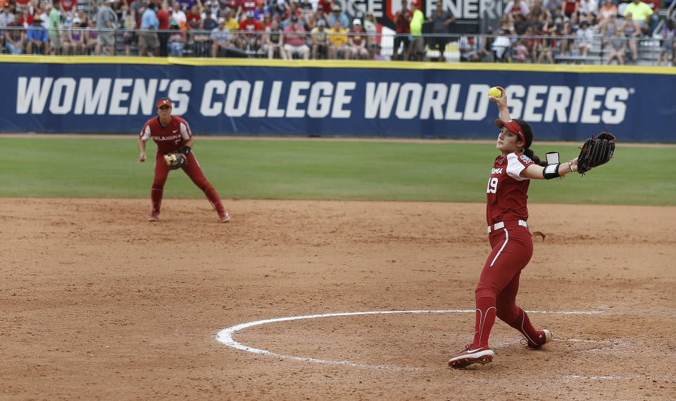 Oklahoma's Nicole May (19) pitches in the sixth inning of an NCAA Women's College World Series softball game against Georgia, Saturday, June 5, 2021, in Oklahoma City. (AP Photo/Alonzo Adams)