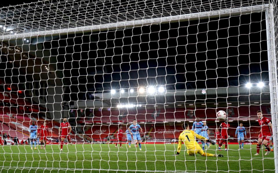 Liverpool's Diogo Jota (right) scores his side's second goal of the game during the Premier League match at Anfield - PA