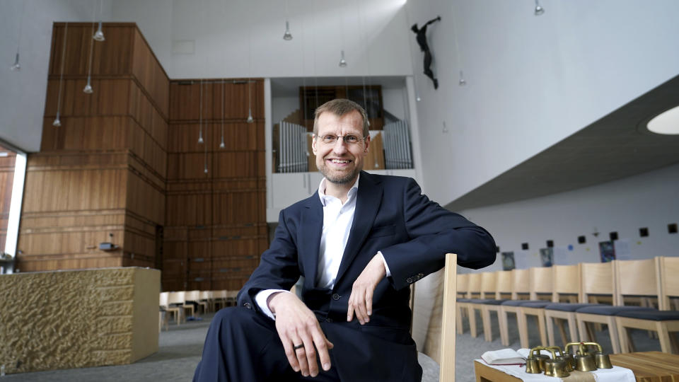 Jesuit Father Jan Korditschke, who will lead blessings for same-sex couples in Berlin in the upcoming week, poses for a photo at the Canisius Church in Berlin, Germany, Friday, May 7, 2021. Germany’s Catholic progressives are openly defying a recent Holy See pronouncement that priests cannot bless same-sex unions by offering exactly such blessings at services in about 100 different churches all over the country. The blessings at open worship services are the latest pushback from German Catholics against a document released in March by the Vatican’s orthodoxy office, which said Catholic clergy cannot bless same-sex unions. (AP Photo/Michael Sohn)