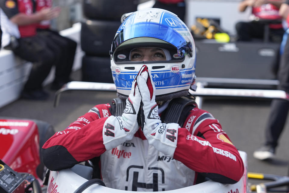 Katherine Legge, of England, reacts after she qualified for the Indianapolis 500 auto race at Indianapolis Motor Speedway, Saturday, May 20, 2023, in Indianapolis. (AP Photo/Darron Cummings)