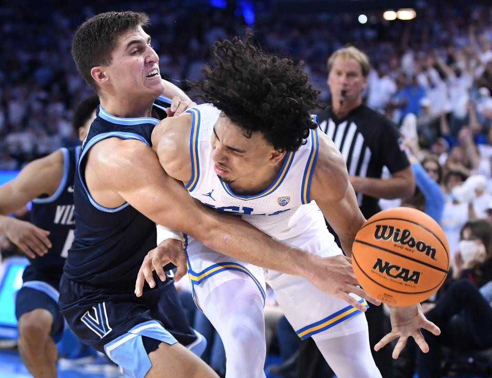 UCLA's Jules Bernard is fouled by Villanova's Collin Gillespie in overtime Friday.