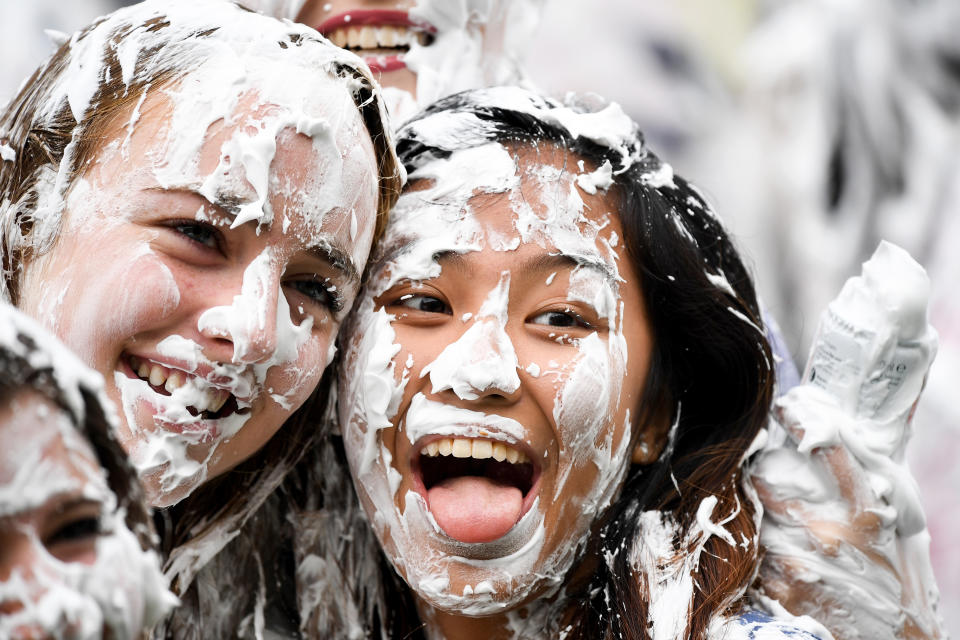 <p>Students from St Andrews University indulge in a tradition of covering themselves with foam to honor the “academic family” on Lower College Lawn on Oct. 23, 2017, in St Andrews, Scotland. (Photo: Jeff J Mitchell/Getty Images) </p>