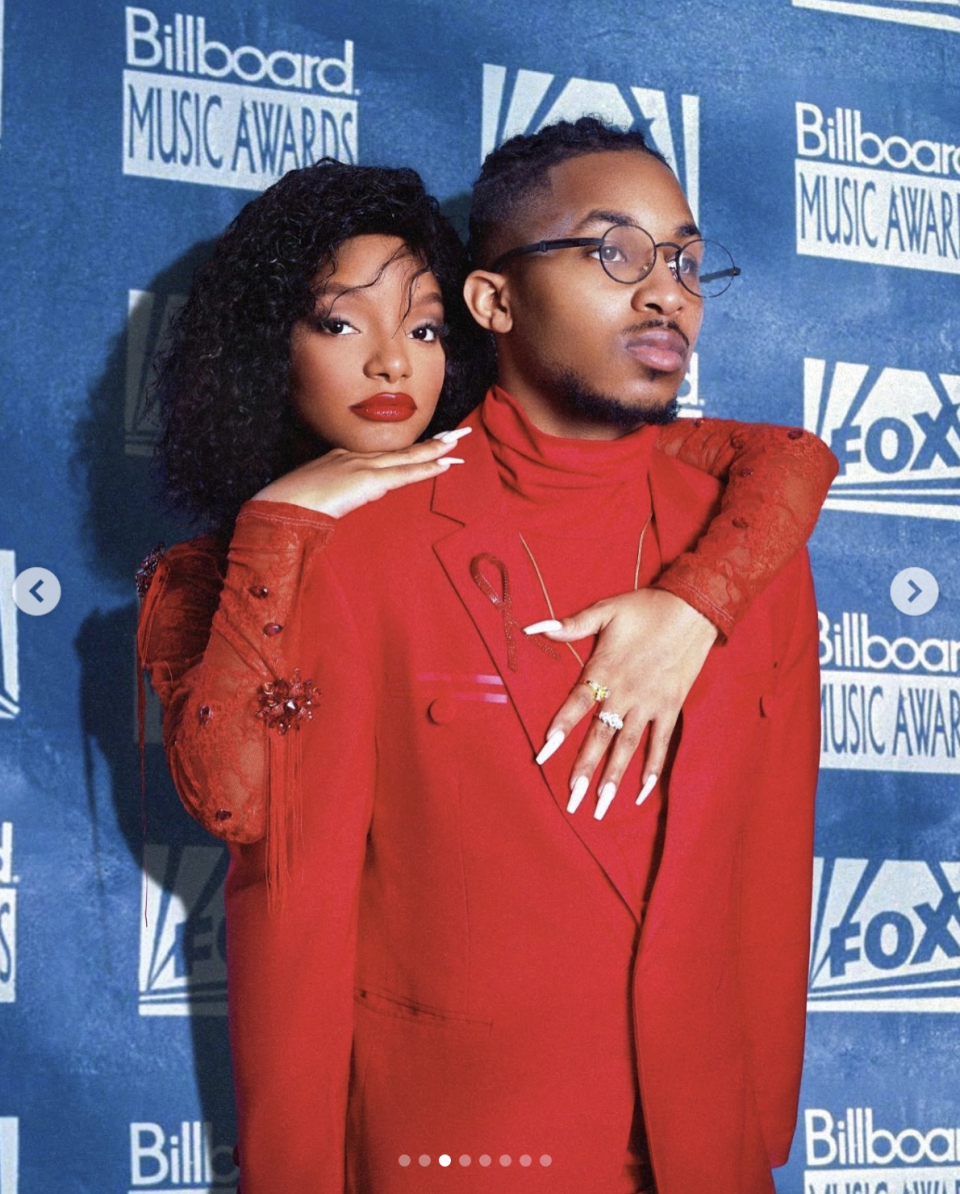 both of them in red posing exactly like whitney and bobby