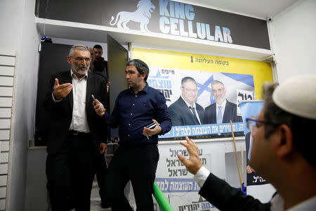 Michael Ben-Ari from the Jewish Power party chats with his party's members in Jerusalem, March 17, 2019. REUTERS/Ronen Zvulun