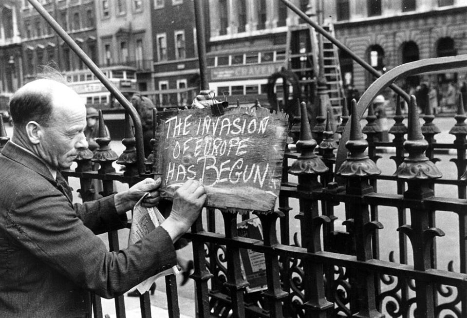 A newspaper seller in London announces the start of the Allied invasion of Europe on D-Day. (Photo from Picture Post/Getty Images)