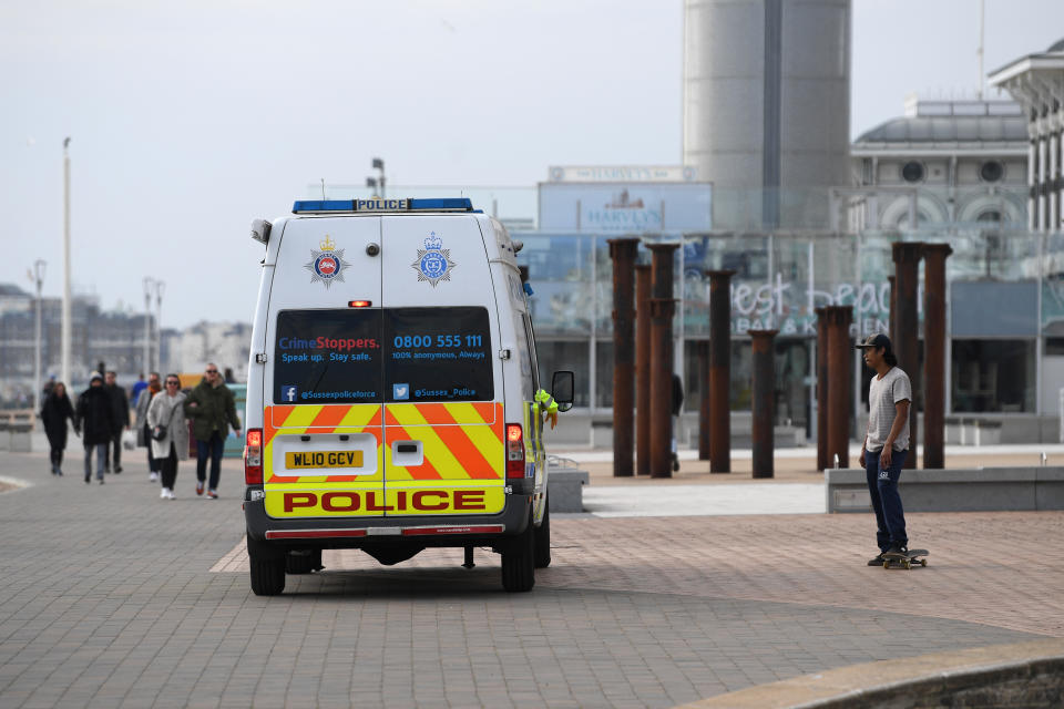 BRIGHTON, ENGLAND - APRIL 01: Police community support officers patrolling Brighton seafront talk to a skateboarder on April 01, 2020 in Brighton, England. The Coronavirus (COVID-19) pandemic has spread to many countries across the world, claiming over 40,000 lives and infecting hundreds of thousands more. (Photo by Mike Hewitt/Getty Images)