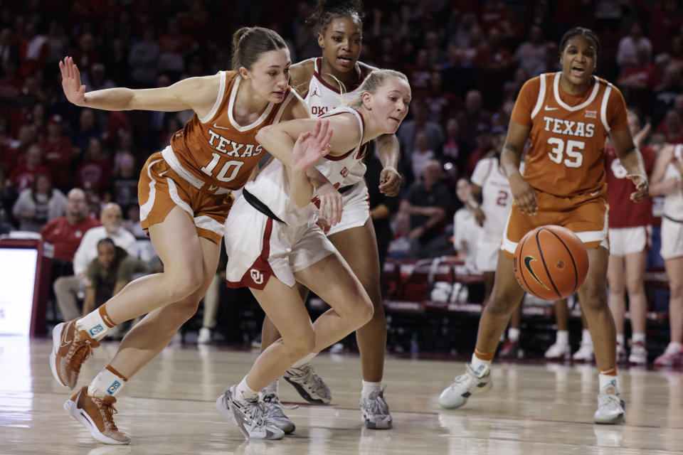 Texas guard Shay Holle (10) and Oklahoma guard Aubrey Joens fight for the ball while Oklahoma forward Sahara Williams and Texas forward Madison Booker (35) look on during the second half of an NCAA college basketball game Wednesday, Feb. 28, 2024, in Norman, Okla. (AP Photo/Garett Fisbeck)