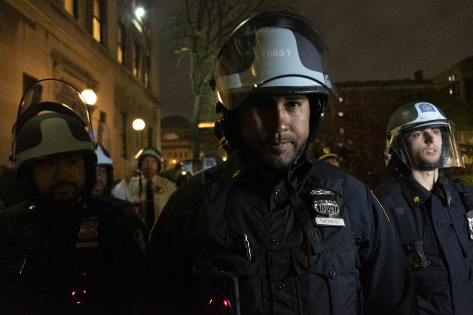 Officers with the New York Police Department stand outside Columbia University's Hamilton Hall as they disperse Pro-Palestine students and protestors occupying Hamilton Hall on Tuesday evening, April 30, 2024 in New York. Members of the occupation took over Hamilton Hall in the early hours of Tuesday morning. (Seyma Bayram via AP)