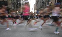 Competitors race down State Street during the 45th annual Chicago Marathon on Sunday, Oct. 8, 2023. (Trent Sprague /Chicago Tribune via AP)