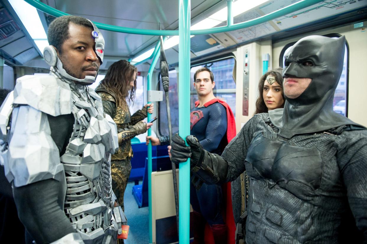 The characters Cyborg, Aquaman, Superman, Wonder Woman and Batman from the Justice League film pose in character on the London Underground during a photocall en route to The Leicester Square Odeon Cinema before the UK premier on November 15, 2017 in London, England.