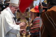 Pope Francis is greeted by faithful during an offertory as he celebrates a Mass at Lobito beach in Iquique, Chile, January 18, 2018. REUTERS/Alessandro Bianchi