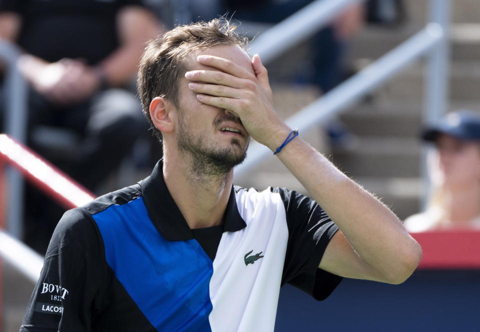 Daniil Medvedev reacts during his match against Nick Kyrgios of Australia during second round play at the National Bank Open tennis tournament Wednesday Aug. 10, 2022. in Montreal. (Paul Chiasson/The Canadian Press via AP)