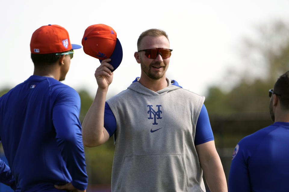 New York Mets' Pete Alonso talks with teammates during a spring training baseball workout Saturday, Feb. 17, 2024, in Port St. Lucie, Fla. (AP Photo/Jeff Roberson)