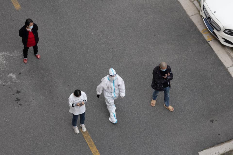 People line up for a Covid-19 test at a residential area  on 22 April 2022 in Shanghai, China (Getty Images)