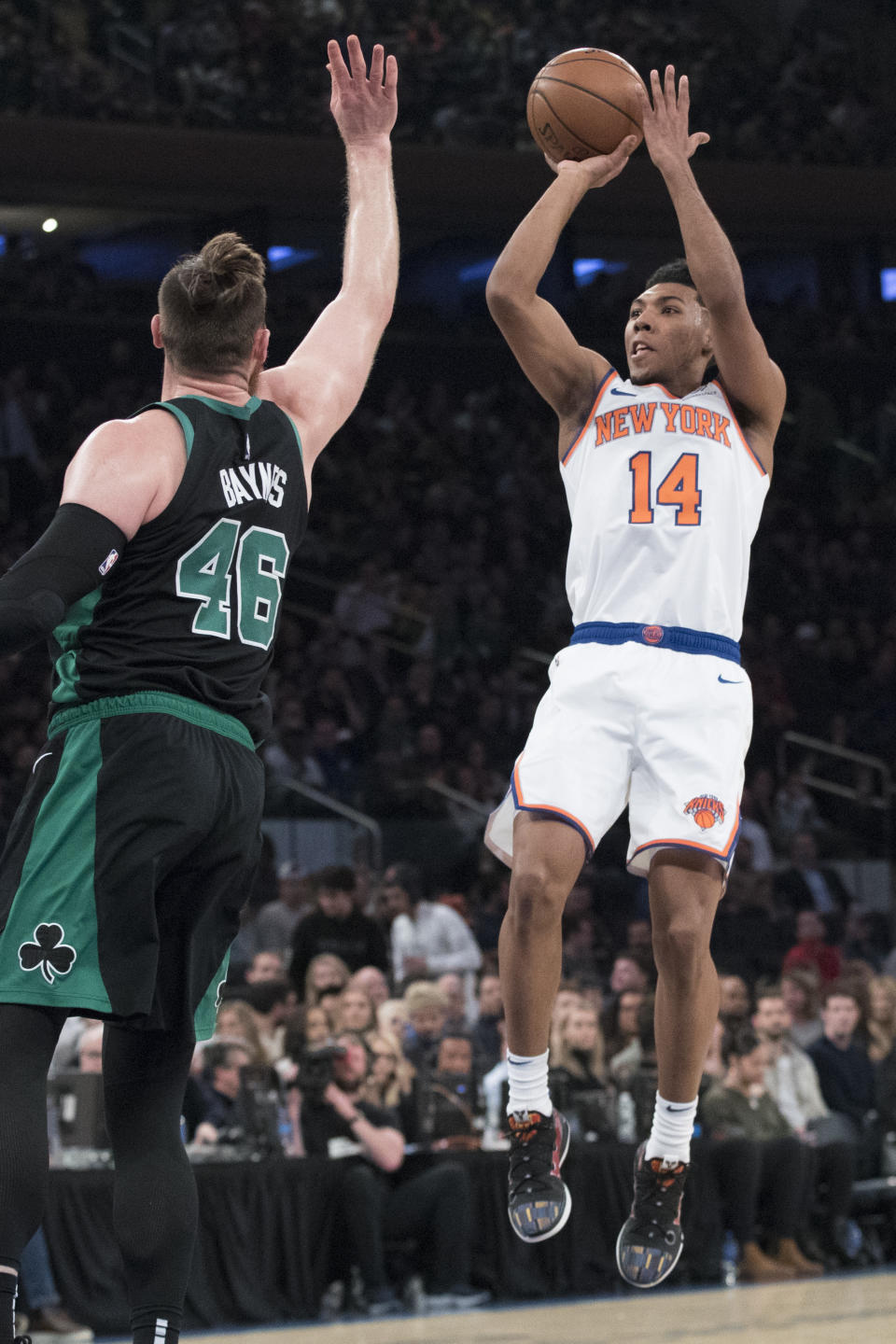 New York Knicks guard Allonzo Trier (14) shoots a 3-point goal past Boston Celtics center Aron Baynes (46) during the first half of an NBA basketball game Friday, Feb. 1, 2019, at Madison Square Garden in New York. (AP Photo/Mary Altaffer)