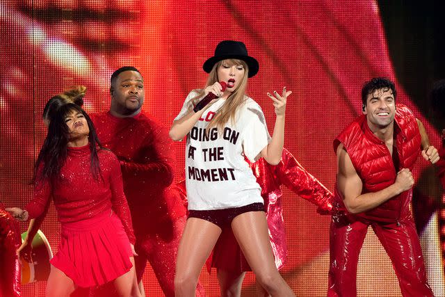 <p>Kevin Mazur/Getty</p> Taylor Swift performing on stage during her Eras Tour.