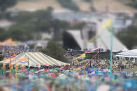 <p>People walk round the Glastonbury Festival site at Worthy Farm in Pilton on June 23, 2017 near Glastonbury, England. (Photo: Matt Cardy/Getty Images) </p>