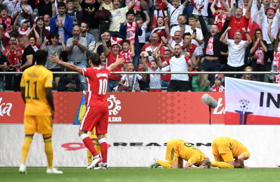 Wales players are dejected after conceding during their 2-1 Nations League defeat to Poland in June (Rafal Oleksiewicz/PA) (PA Wire)