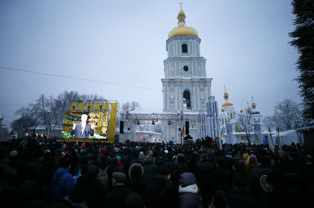 Ukrainian believers gather at the front of the Saint Sophia's Cathedral during church council to convene to create an independent Ukrainian Orthodox church in Kiev, Ukraine December 15, 2018. REUTERS/Gleb Garanich