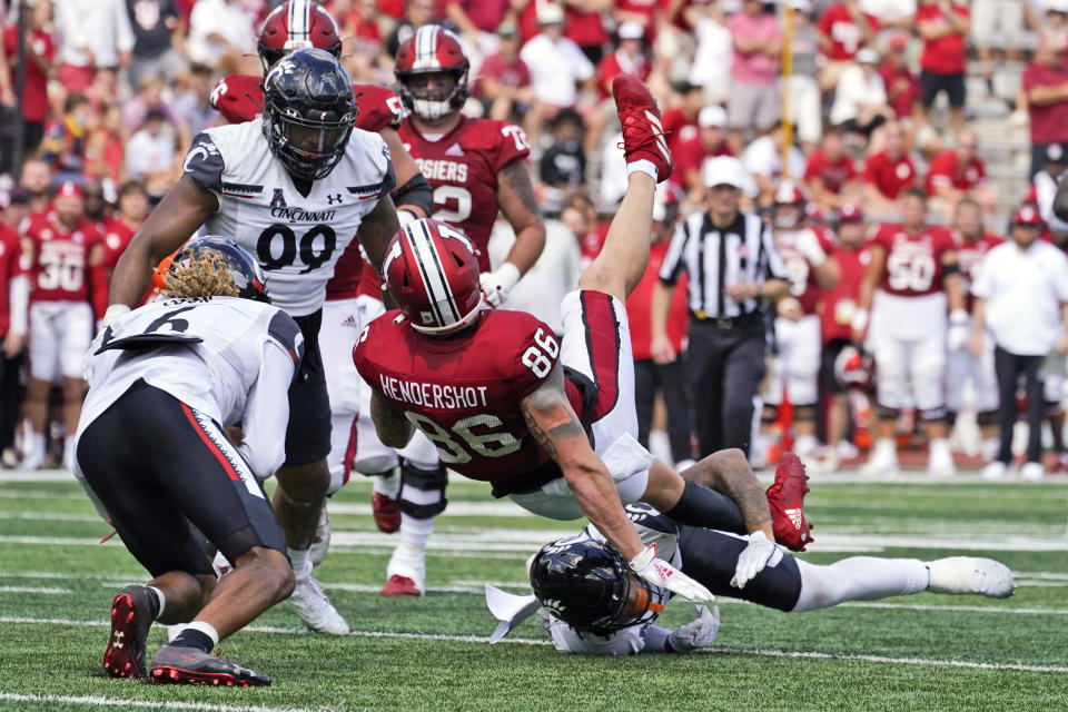 Indiana's Peyton Hendershot (86) is tackled Cincinnati's Deshawn Pace (20) during the first half of an NCAA college football game, Saturday, Sept. 18, 2021, in Bloomington, Ind. (AP Photo/Darron Cummings)