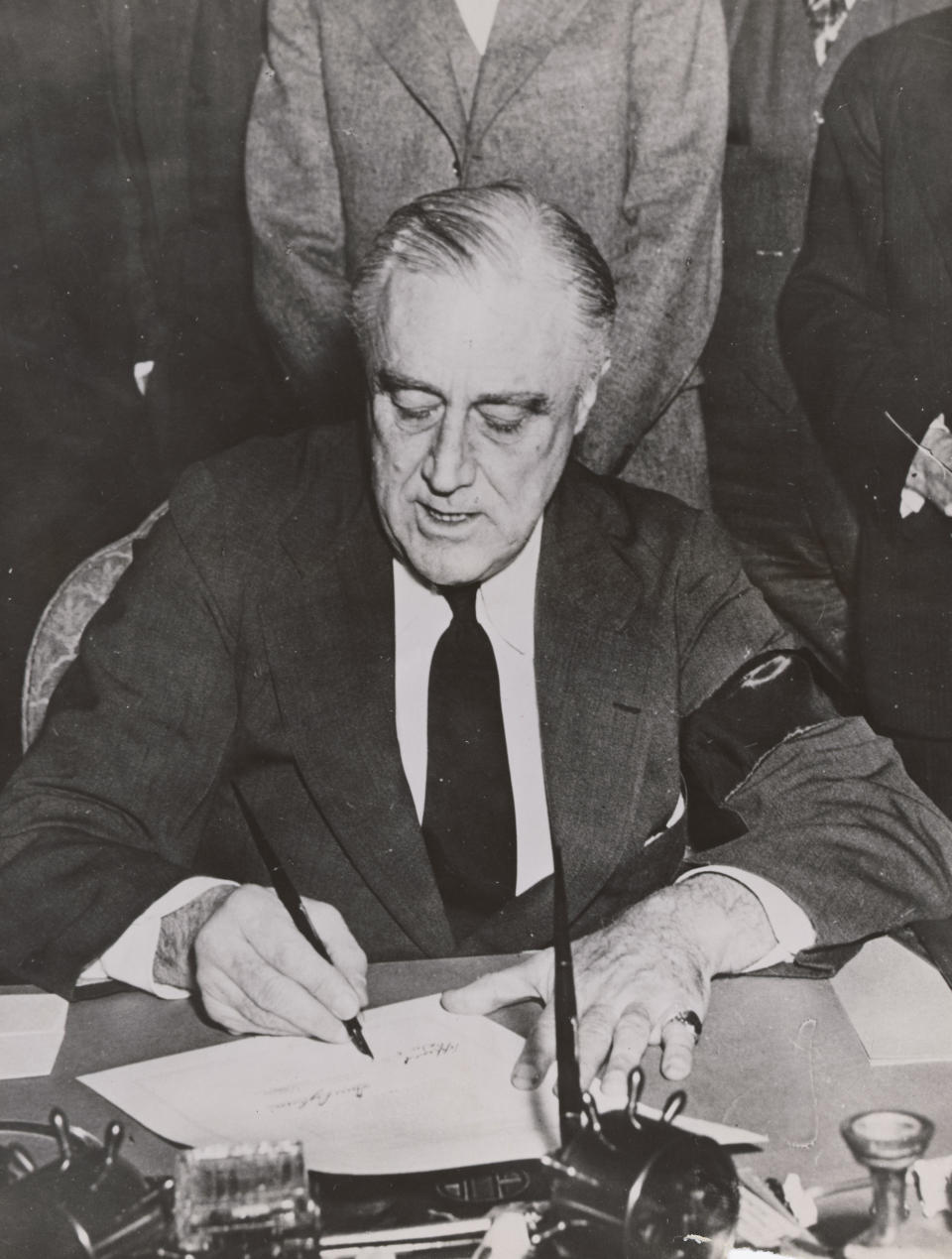 U.S. President Frankin Delano Roosevelt signs the declaration of war on Japan in Washington, DC, U.S. December 8, 1941. The 75th anniversary of the Pearl Harbor attack, which brought the United States into World War Two, is marked on December 7, 2016. U.S. National Archives and Records Administration/Handout via REUTERS   ATTENTION EDITORS - THIS IMAGE WAS PROVIDED BY A THIRD PARTY. EDITORIAL USE ONLY