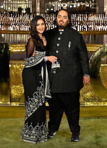 <p>Vijay Bate/Hindustan Times via Getty</p> Anant Ambani with Radhika Merchant