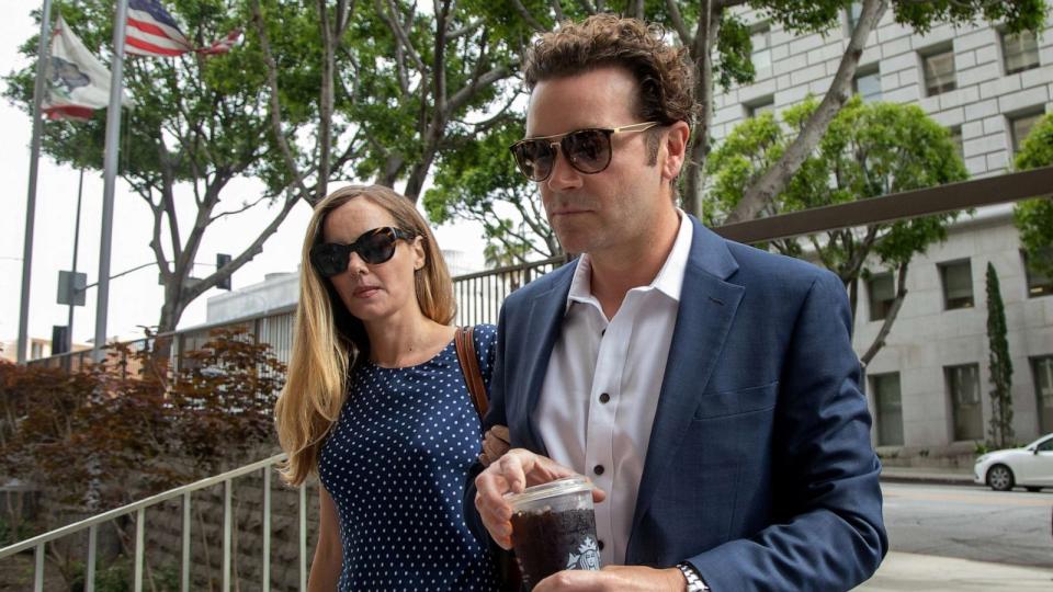 PHOTO: Danny Masterson arrives at Clara Shortridge Foltz Criminal Justice Center in Los Angeles, May 31, 2023 with wife Bijou Phillips. (Myung J. Chun/Los Angeles Times via Getty Images)