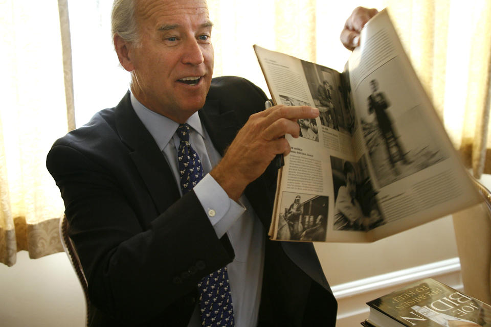 FILE - In this Aug. 13, 2008, file photo, then-Democratic presidential hopeful Sen. Joe Biden holds up a 1972 "Life" magazine with his picture in it that was given to him to sign after speaking to the Nashua Rotary Club in Nashua, N.H. (AP Photo/Cheryl Senter, File)