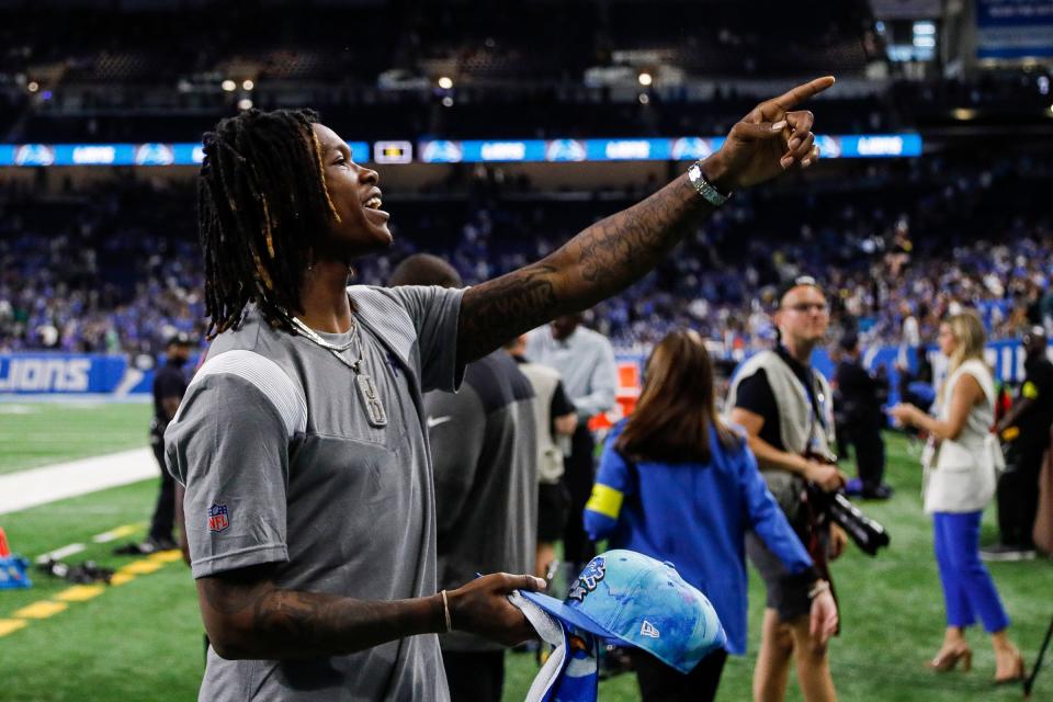 Detroit Lions injured rookie receiver Jameson Williams waves at fans after the Lions' 38-35 loss to the Philadelphia Eagles at Ford Field, Sept. 11, 2022.