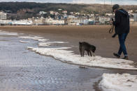 <p>The shoreline waters at Weston-super-Mare in Somerset froze over as the Beast from the East moved in. Ian, 48, said: ‘I was out walking along the seafront with my partner Calin and we could see a long white line at the high water line. (SWNS) </p>
