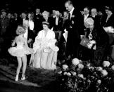 <p>Queen Elizabeth receives a curtsy from a young dancer from the Winnipeg Ballet during her royal tour of Canada in 1951.</p>