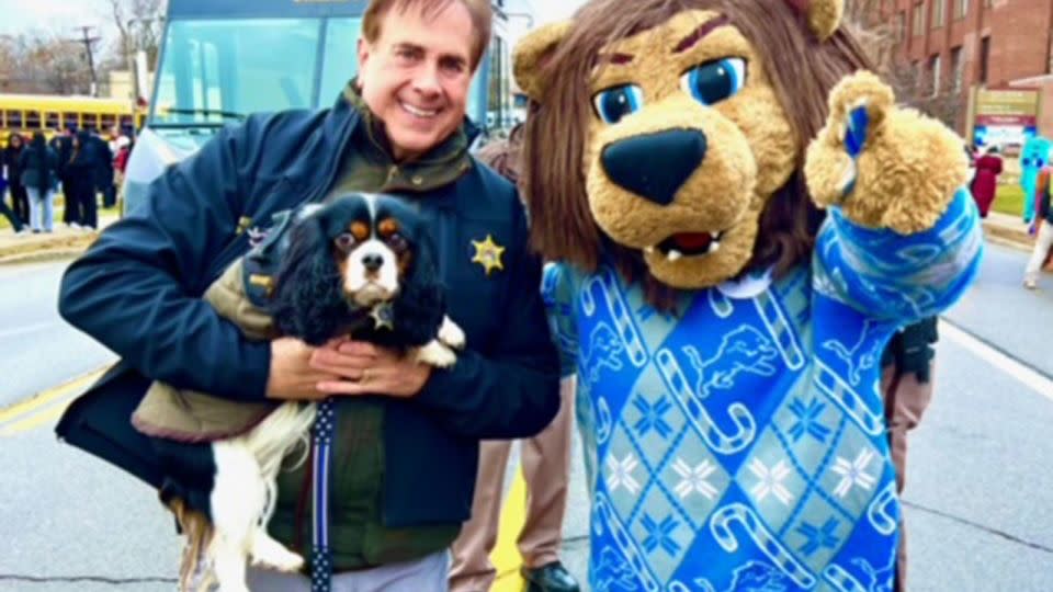 Sheriff Michael Bouchard poses with Max and a costumed mascot. - Courtesy Sheriff Michael J. Bouchard