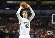 FILE - Baylor's Brittney Griner shoots a foul shot against Louisville in the second half of a regional semifinal game in the women's NCAA college basketball tournament in Oklahoma City, April 1, 2013. Baylor will retire the jersey of former star Griner, Feb. 18, 2024, when the Bears host Texas Tech. (AP Photo/Sue Ogrocki, File)