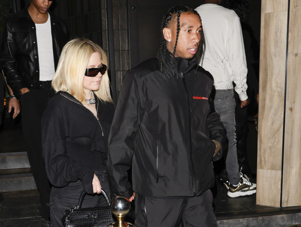 <p>Avril Lavigne and Tyga are seen in matching 'fits while out and about in Los Angeles on March 16.</p>