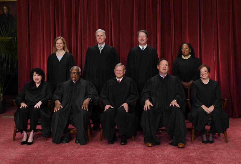 Justices of the Supreme Court pose for their official photo at the Supreme Court in Washington, D.C. on October 7, 2022. 
(Seated from left) Justice Sonia Sotomayor, Justice Clarence Thomas, Chief Justice John Roberts, Justice Samuel Alito, and Justice Elena Kagan. (Standing behind from left) Justice Amy Coney Barrett, Justice Neil Gorsuch, Justice Brett Kavanaugh and Justice Ketanji Brown Jackson. (Photo by OLIVIER DOULIERY/AFP via Getty Images)