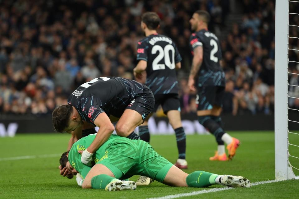 Manchester City’s Ruben Dias embraces goalkeeper Stefan Ortega (Getty Images)