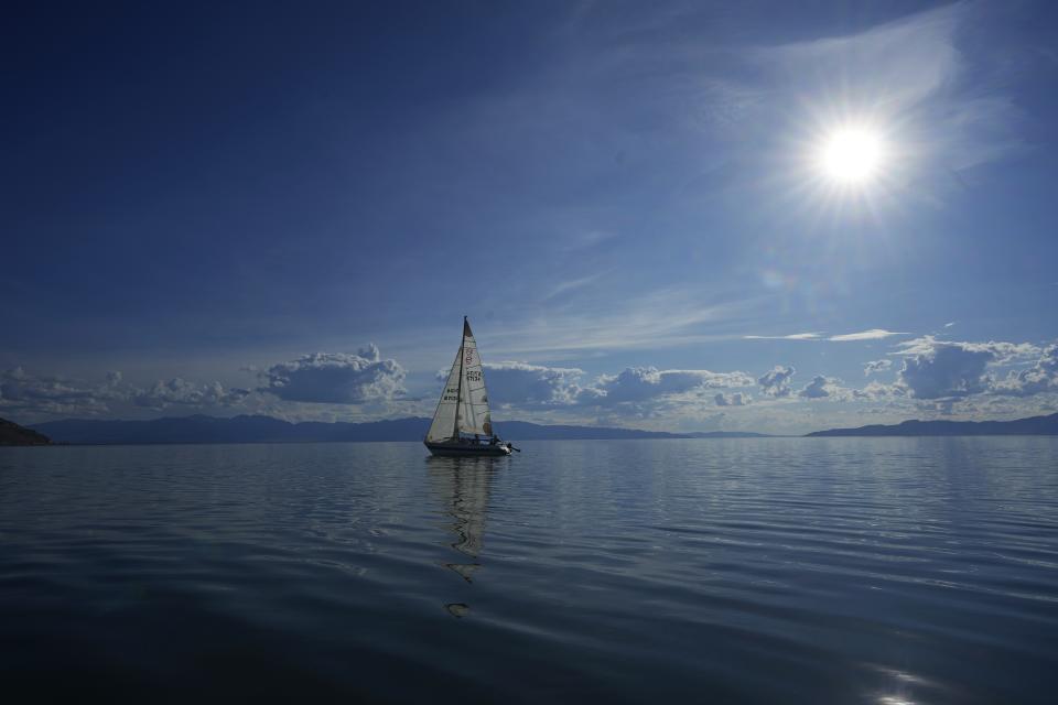 People sail on the Great Salt Lake on June 14, 2023, near Magna, Utah. Sailors back out on the water are rejoicing after a snowy winter provided temporary reprieve to long-term drought projections facing the Great Salt Lake. (AP Photo/Rick Bowmer)
