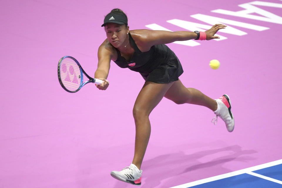 Naomi Osaka, of Japan returns a shot against Karolina Pliskova, of Czech Republic during the final match of the Pan Pacific Open women's tennis tournament in Tokyo Sunday, Sept. 23, 2018. (AP Photo/Eugene Hoshiko)