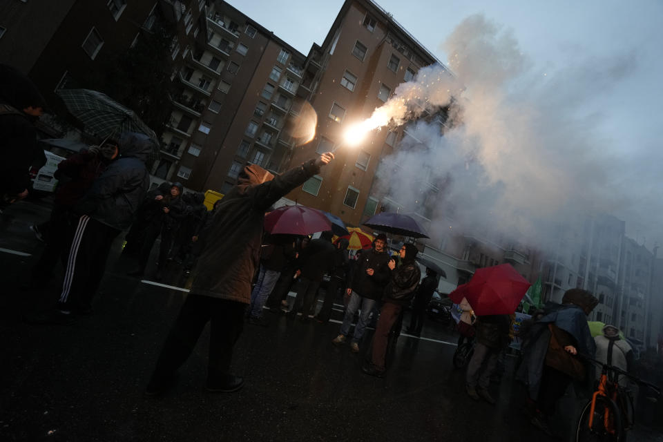 Activists of the C.I.O Comitato Insostenibili Olimpiadi (Unsustainable Olympics Commetee) march in Milan, northern Italy, Saturday, Feb. 10, 2024, to protest the prospected costs of the 2026 Winter Olympics that will be disputed in Milan and Cortina d'Ampezzo in the Dolomites. (AP Photo/Luca Bruno)