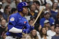 Chicago Cubs' Sergio Alcantara hits a broken bat RBI single during the fourth inning of a baseball game against the Milwaukee Brewers Friday, Sept. 17, 2021, in Milwaukee. (AP Photo/Morry Gash)