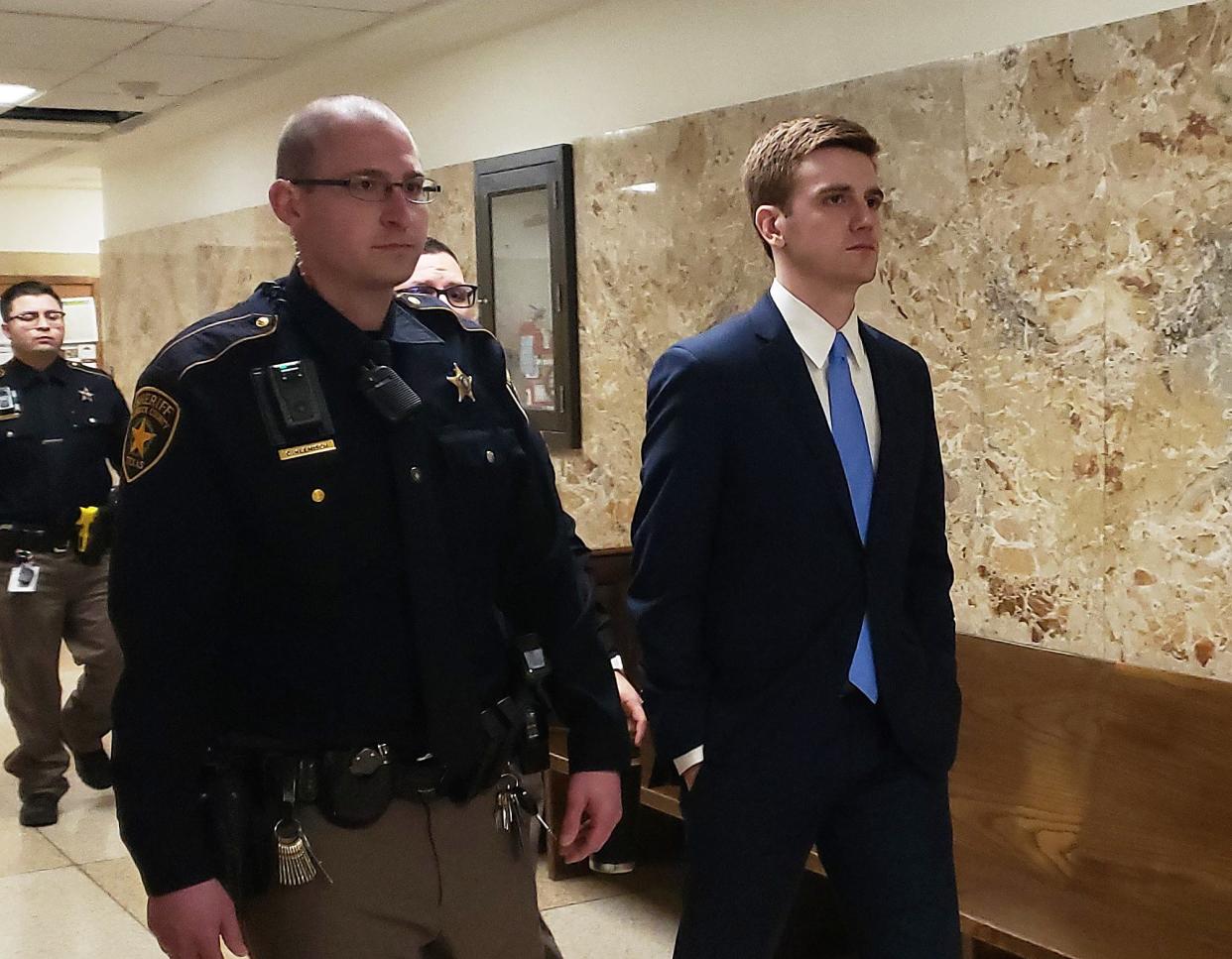 Hollis Daniels III is escorted out of the courtoom during a break in his trial for capital murder in the October 2017 shooting death of Texas Tech police officer Floyd East Jr.