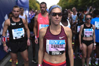Keira d'Amato, center, from United States waits for the start of the Berlin Marathon in Berlin, Germany, Sunday, Sept. 25, 2022. (AP Photo/Christoph Soeder)