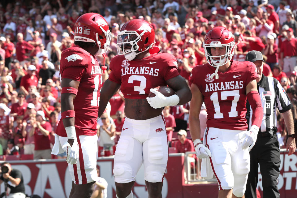 Sep 9, 2023; Fayetteville, Arkansas, USA; Arkansas Razorbacks linebacker Antonio Grier (3) celebrates with teammates after returning an interception for a touchdown in the first quarter against the Kent State Golden Flashes at Donald W. Reynolds Razorback Stadium. Mandatory Credit: Nelson Chenault-USA TODAY Sports