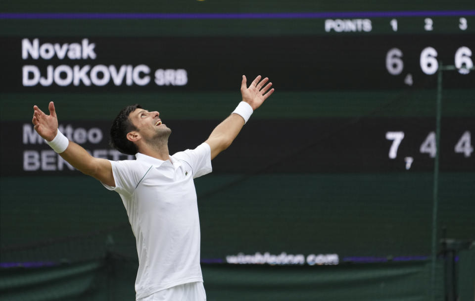 Serbia's Novak Djokovic celebrates his victory over Italy's Matteo Berrettini in the men's singles final match on day thirteen of the Wimbledon Tennis Championships in London, Sunday, July 11, 2021. (AP Photo/Alberto Pezzali)