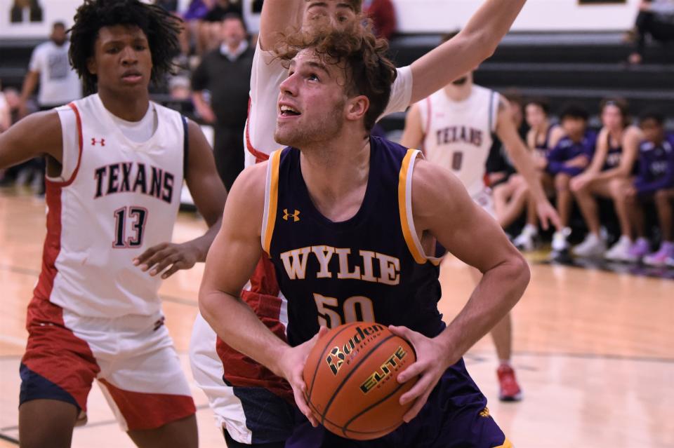 Wylie's Avery Brekke (50) looks up towards the basket during Saturday's game against Justin Northwest on the final day of the Key City Classic.