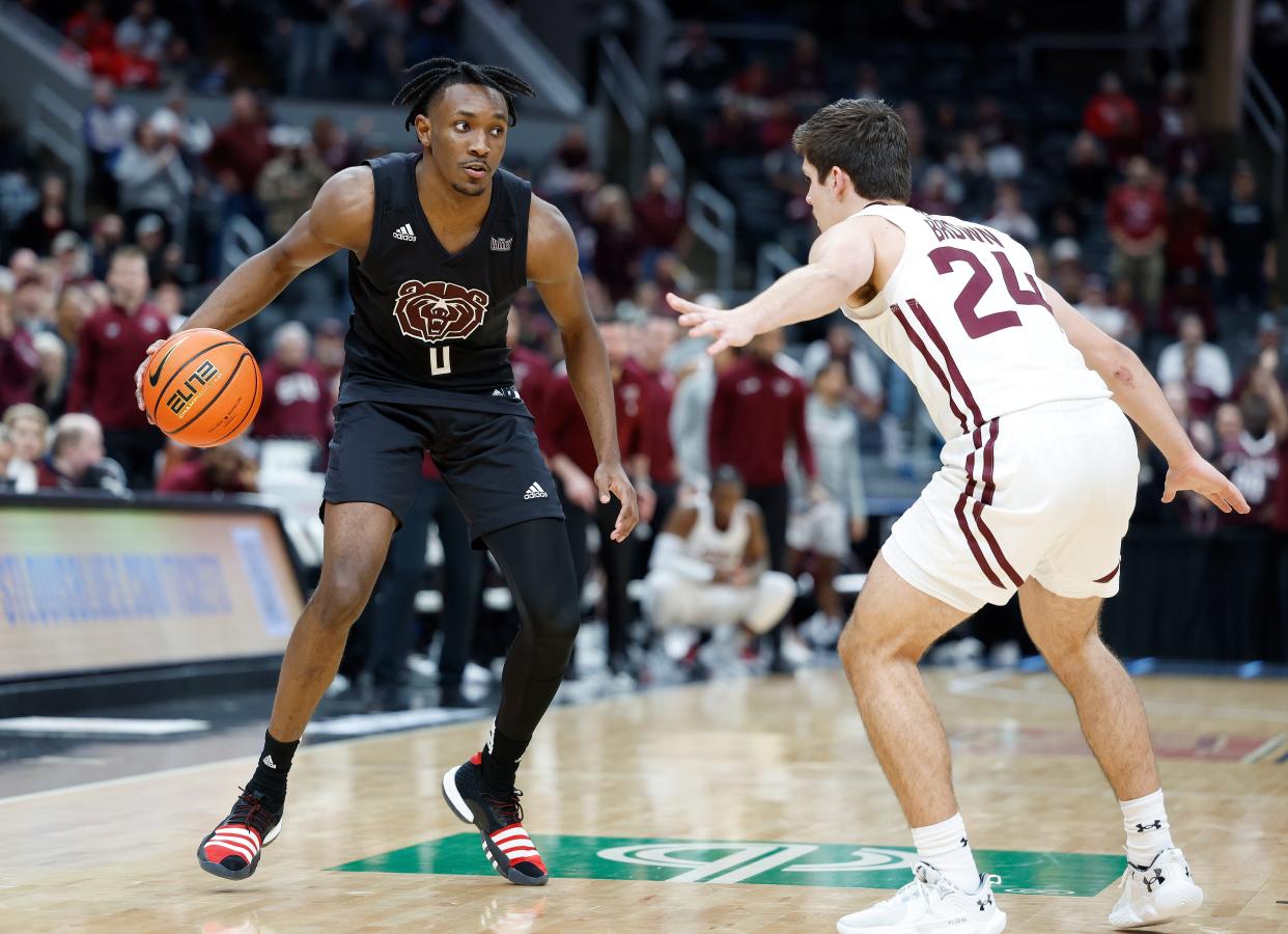 Missouri State's Chance Moore (0) looks to move the ball during a Missouri Valley Conference Tournament game against Southern Illinois, Friday, March 3, 2023, at Enterprise Center in St. Louis. 