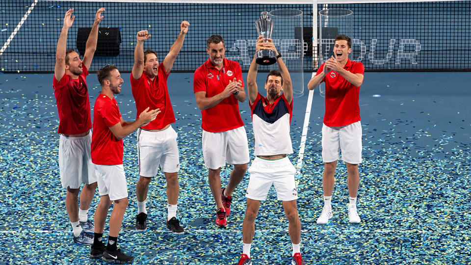 Novak Djokovic, pictured here lifting the trophy after leading Serbia to victory.